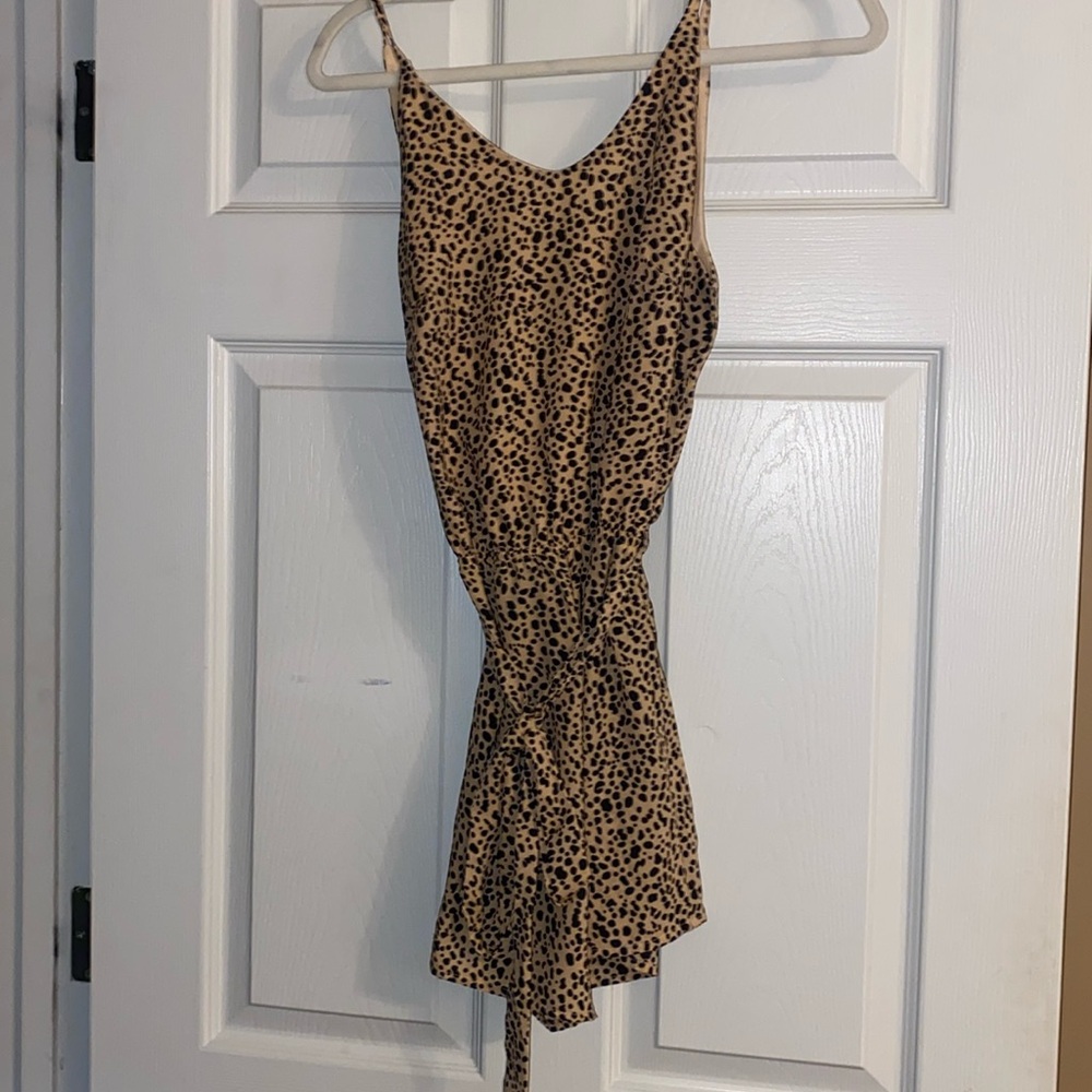 EUC. Cheetah print romper with elastic waist. Ties at waist